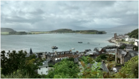 The view out from McCaig's Tower, with Mull a dark smudge on the horizon..png